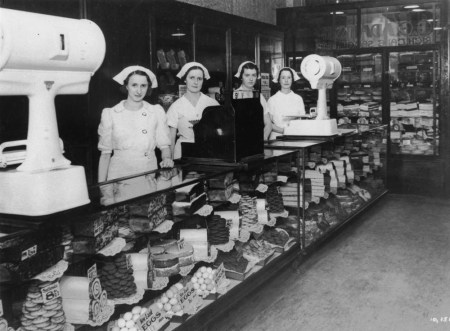 Shop assistants inside George Adams cake shop ca. 1938